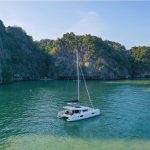 Lagoon 42 Millennium sailing near the Asian cliffs