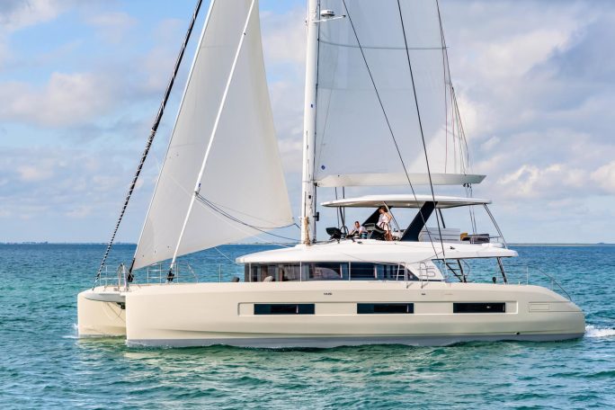 Lagoon Sixty 5 sailing with a couple at the helm