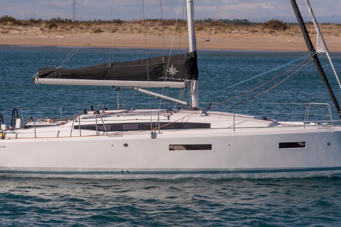 Side view of the Sun Odyssey 380 sailing monohull at anchor