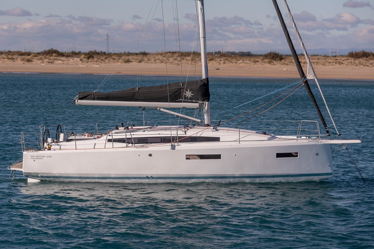 Side view of the Sun Odyssey 380 sailing monohull at anchor