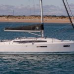 Side view of the Sun Odyssey 380 sailing monohull at anchor