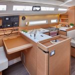 Interior picture of the fully equiped kitchen of the Jeanneau Sun Odyssey 410 sailing monohull
