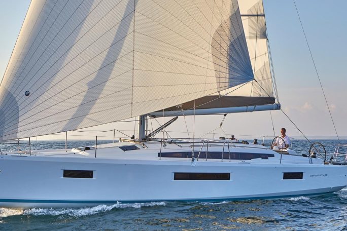 Jeanneau Sun Odyssey 410 sailing with a man at the helm
