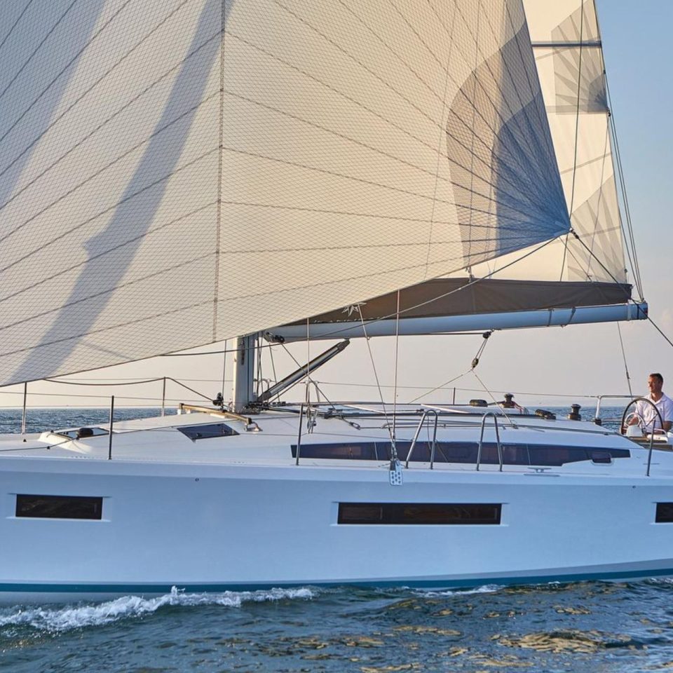 Jeanneau Sun Odyssey 410 sailing with a man at the helm