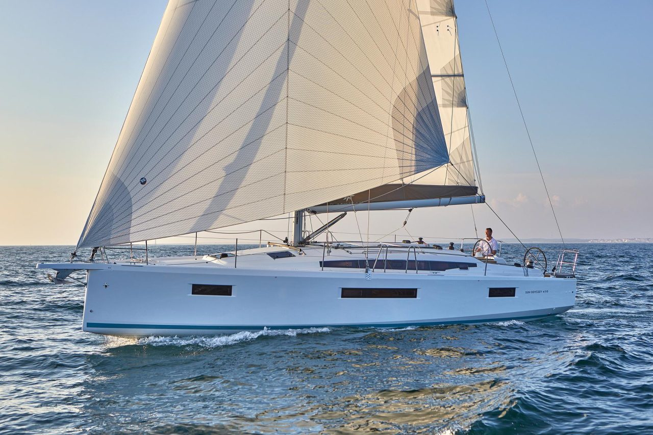 Jeanneau Sun Odyssey 410 sailing with a man at the helm