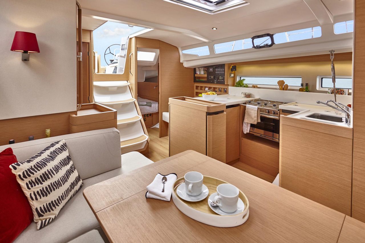 Through view of the Jeanneau Sun Odssey 440 interior with the salon, kitchen and a cabin