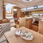 Through view of the Jeanneau Sun Odssey 440 interior with the salon, kitchen and a cabin