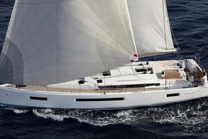 Aerial view of the Jeanneau Sun Odyssey 490 sailing with a couple at the helm