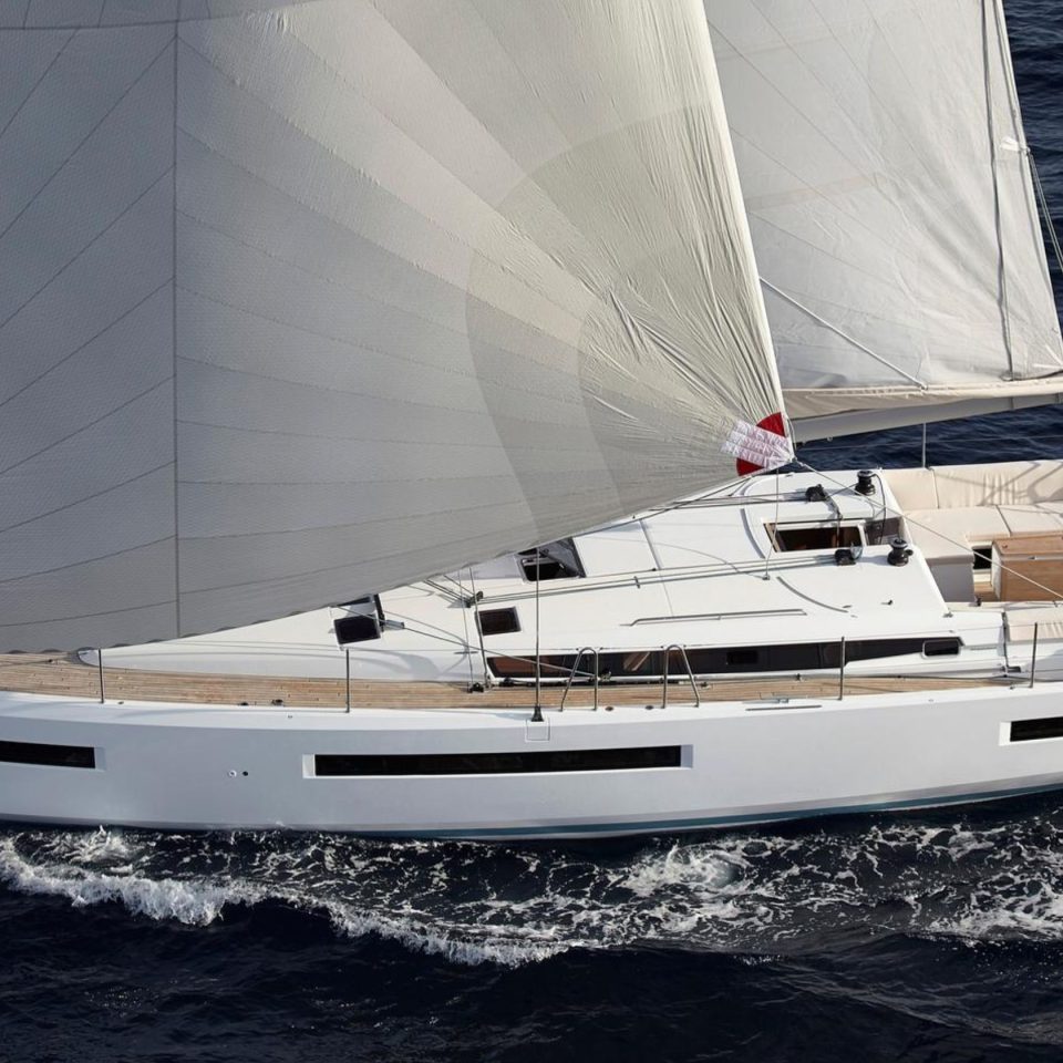 Aerial view of the Jeanneau Sun Odyssey 490 sailing with a couple at the helm