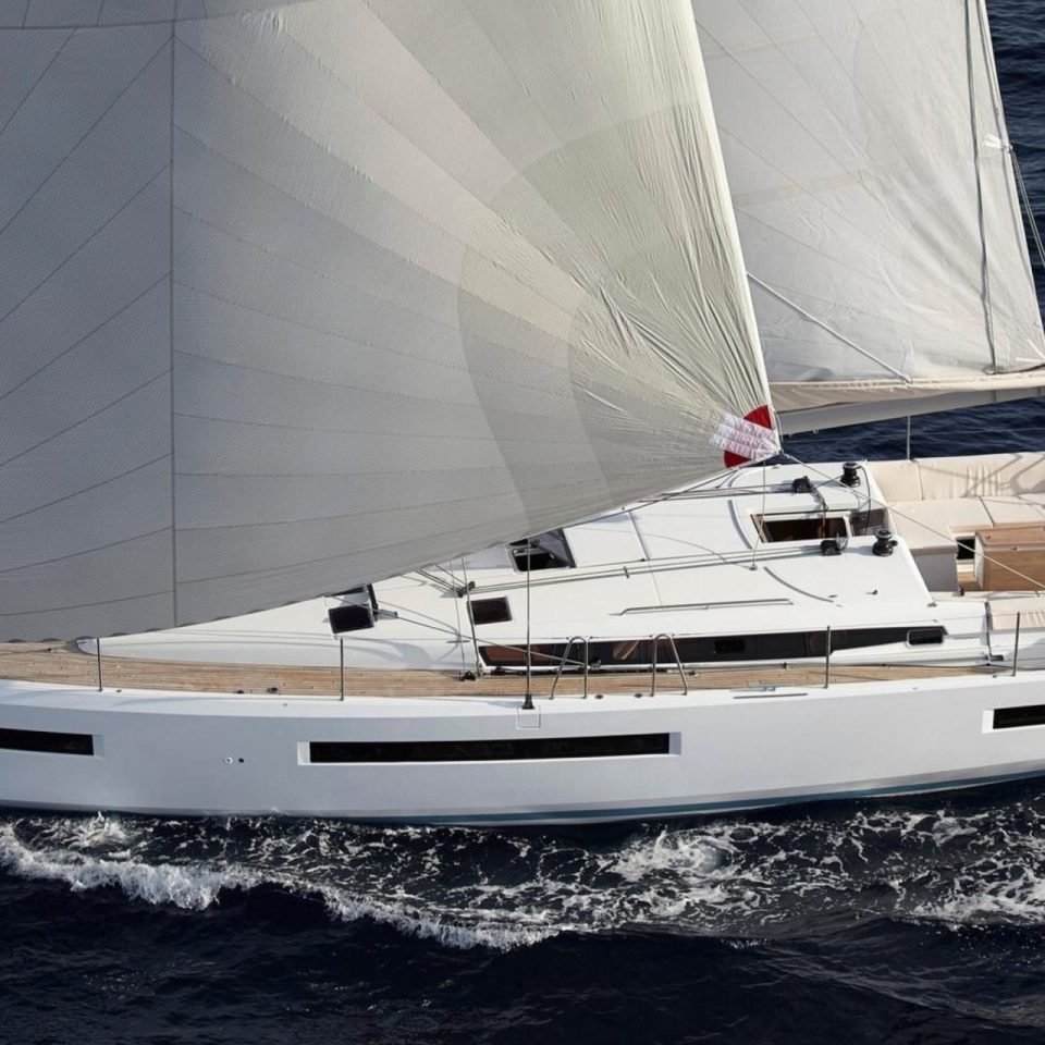Aerial view of the Jeanneau Sun Odyssey 490 sailing with a couple at the helm