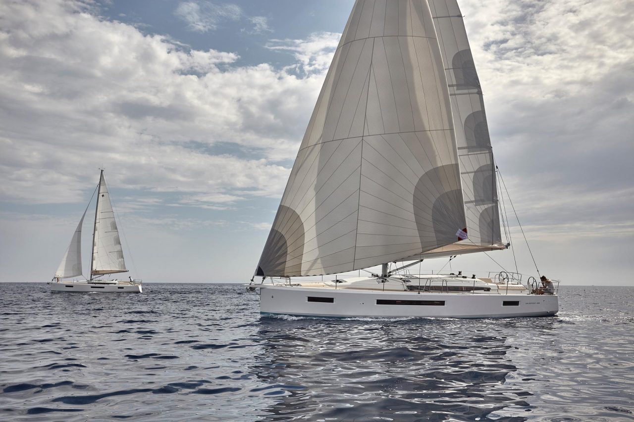 Two Jeanneau Sun Odyssey 490 sailing in deep blue sea