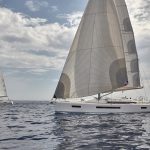 Two Jeanneau Sun Odyssey 490 sailing in deep blue sea