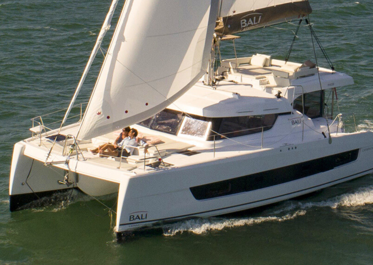 Bali Catspace sailing with guests enjoying the foredeck