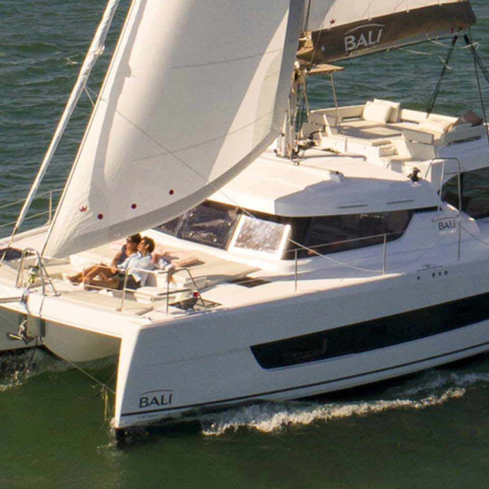 Bali Catspace sailing with guests enjoying the foredeck