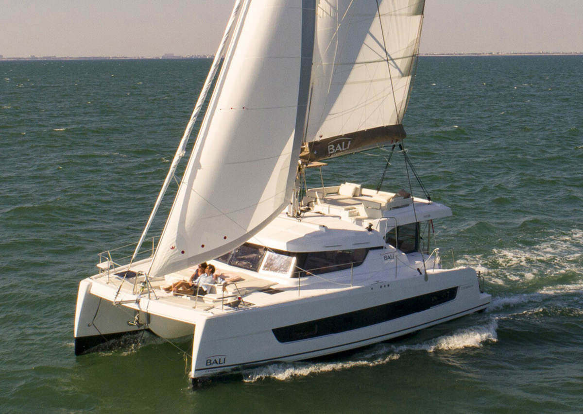 Bali Catspace sailing with guests enjoying the foredeck