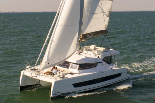 Bali Catspace sailing with guests enjoying the foredeck