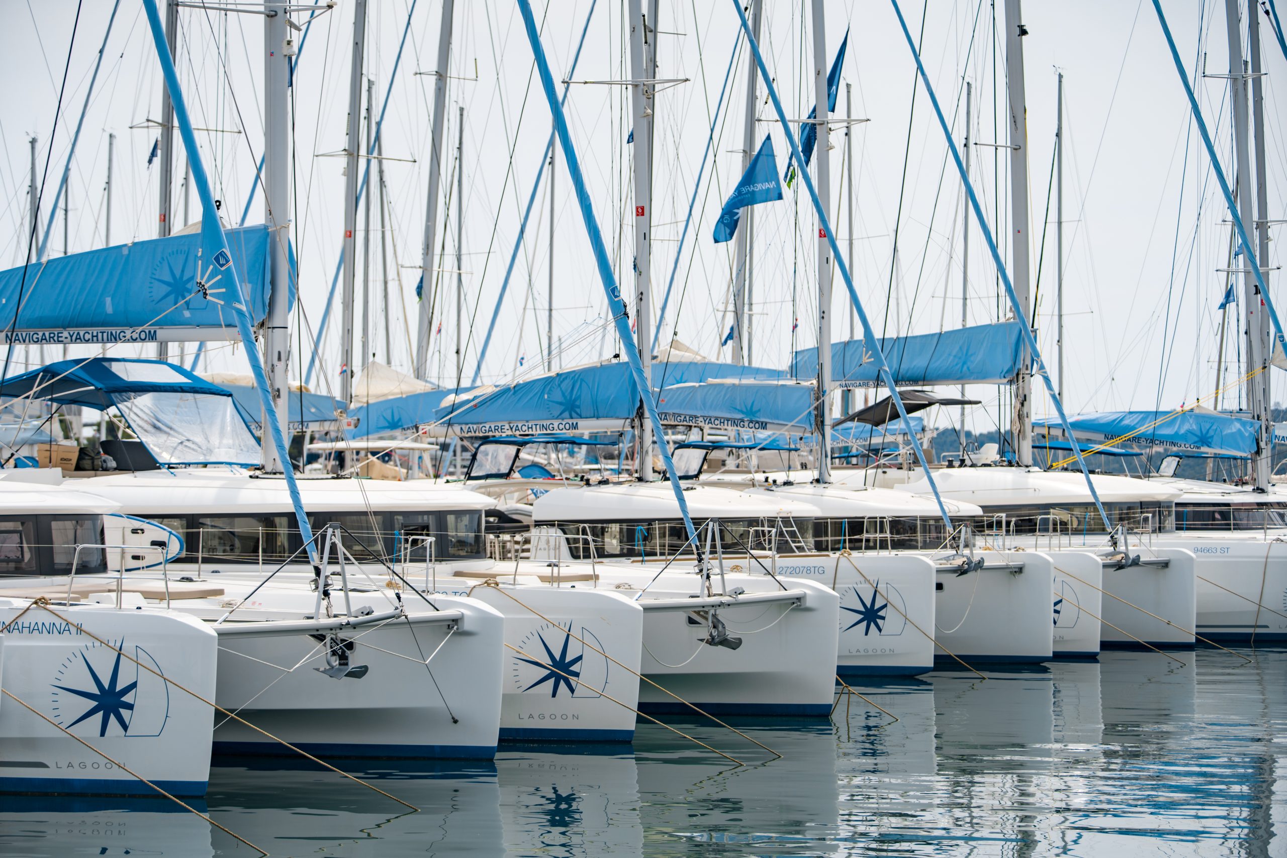 Navigare yachts lined up in the water